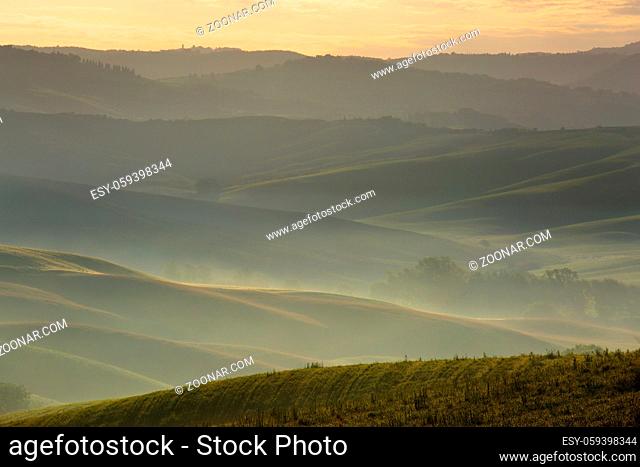 Tuscany foggy morning, farmland hill country landscape. Italy, Europe