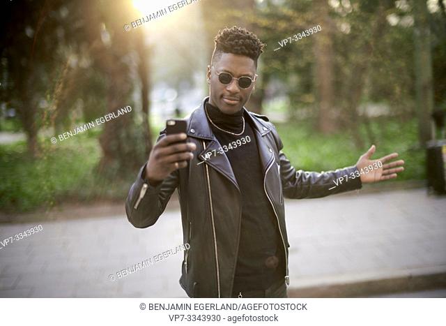 young African man taking selfie smartphone