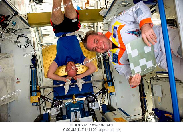 Russian cosmonaut Maxim Suraev (right), Expedition 41 commander; and European Space Agency astronaut Alexander Gerst, flight engineer