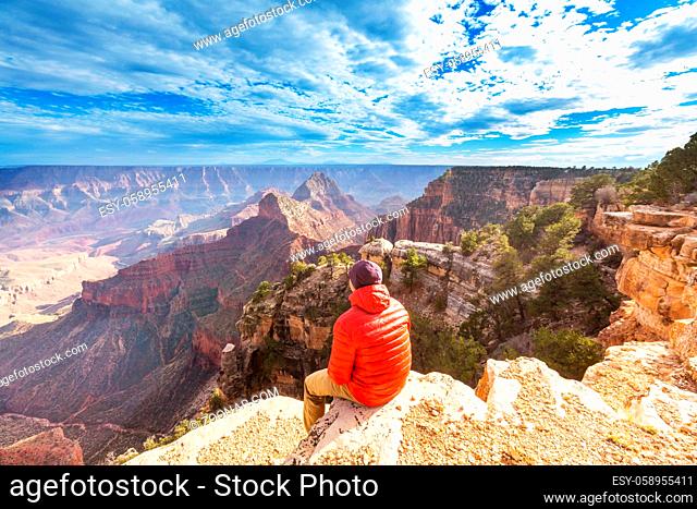 Traveler on cliff mountains over Grand Canyon National Park, Arizona, USA.Inspiring emotion. Travel Lifestyle journey success motivation concept adventure...
