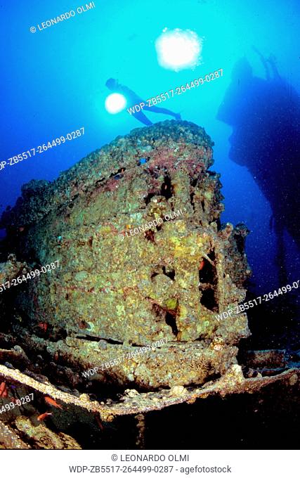 Egypt, Red Sea, Gubal Straight, Thistlegorm Shipwreck, diver on top of a tank
