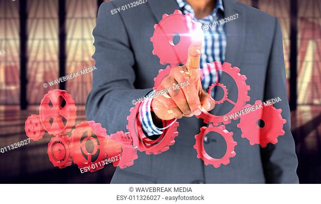 Composite image of focused businessman pointing