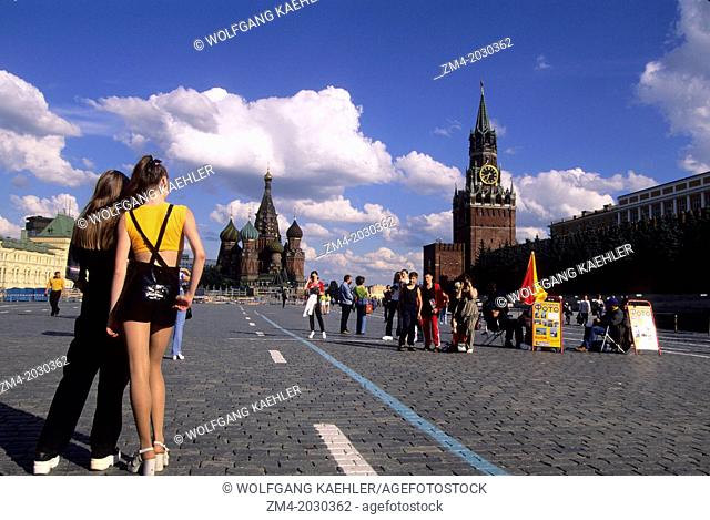 RUSSIA, MOSCOW, RED SQUARE WITH ST BASIL'S CATHEDRAL, SPASSKAYA TOWER, GIRL IN MINI SKIRT