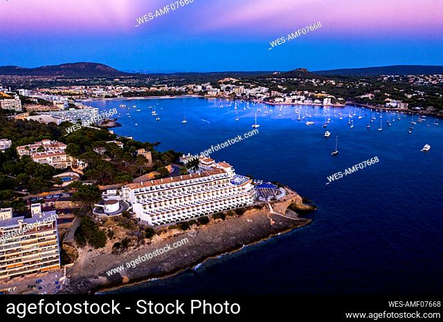 Spain, Balearic Islands, Mallorca, Calvia region, Aerial view over Costa de la Calma and Santa Ponca with hotels and beaches at sunset