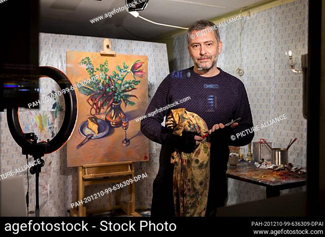 08 December 2020, Berlin: Innokenti Baranov, painter, stands in his studio, which is located in a room of the café and exhibition space Berio in...
