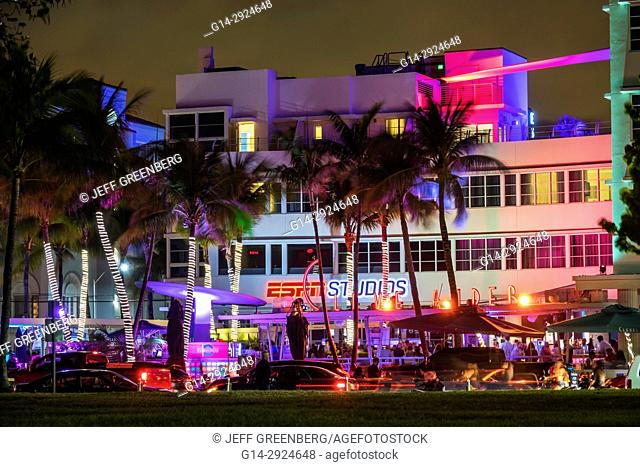 Florida, Miami Beach, Ocean Drive, Art Deco District, night nightlife, Lummus Park, hotels, neon signs, palm trees, evening, Clevelander, hotel, ESPN Studios