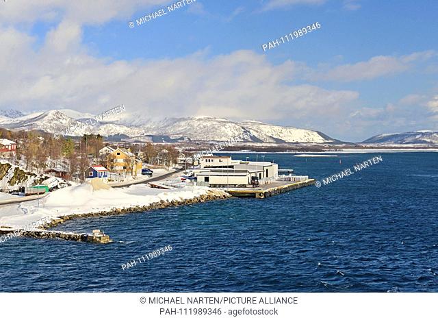 Jetty with warehouses from the small village Risøyhamn in the midst of wide island landscape of Vesterålen, 10 March 2017 | usage worldwide