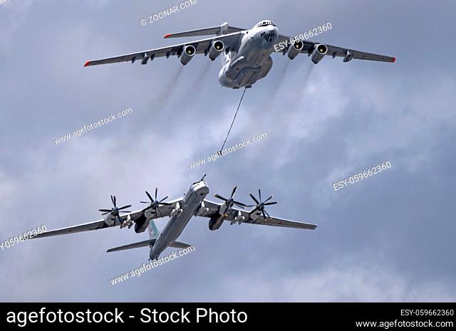 MOSCOW, RUSSIA - MAY 7, 2021: Avia parade in Moscow. tanker Ilyushin Il-78 and strategic bomber and missile platform Tu-95 in the sky on parade of Victory in...