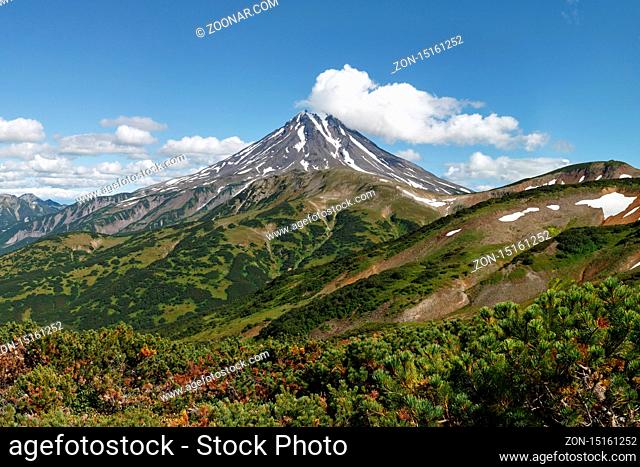 Beautiful volcanic landscape on Kamchatka Peninsula: picturesque view of Vilyuchinsky Volcano at sunny day. Photo stratovolcano photographed with Vilyuchinsky...