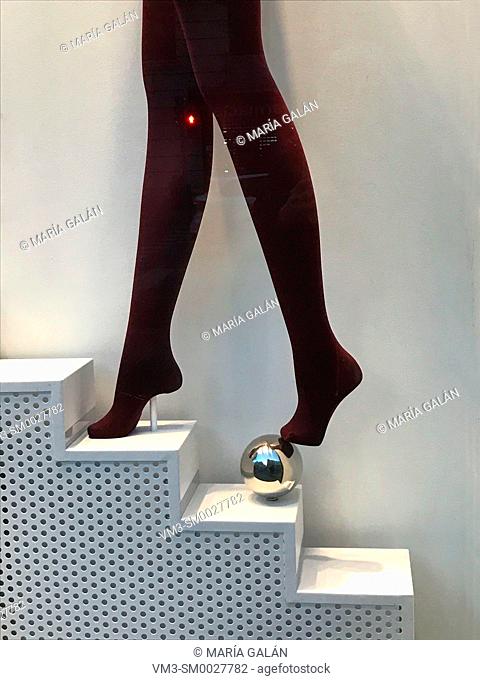 Mannequin legs wearing pantyhose in a shop window