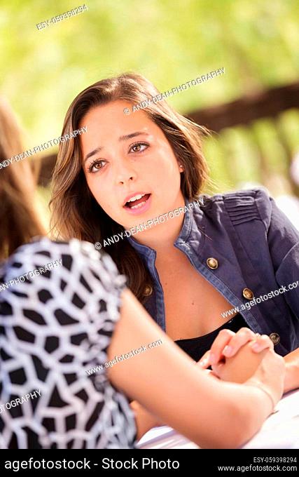 Concerned Young Adult Woman Talking With Her Friend