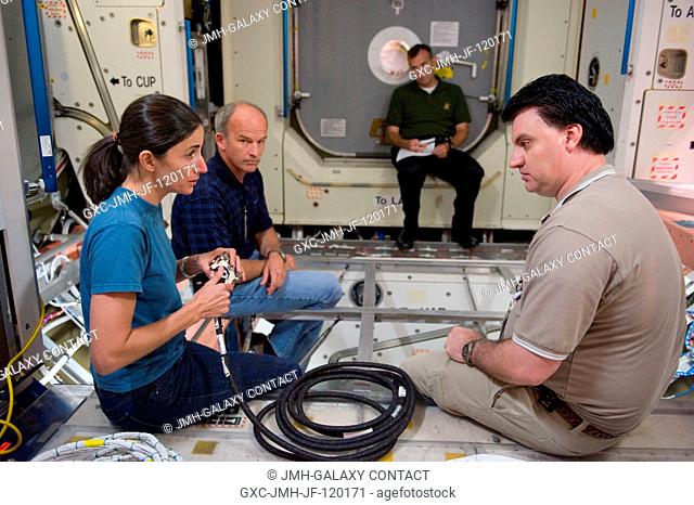 Astronaut Jeffrey Williams (left background), Expedition 21 flight engineer and Expedition 22 commander; and astronaut Nicole Stott