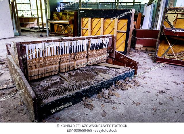Destroyed piano in abandoned music shop in Pripyat ghost city of Chernobyl Nuclear Power Plant Zone of Alienation in Ukraine