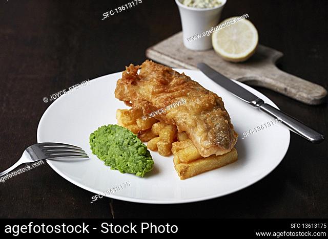 Beer battered fish and chips with mushy peas