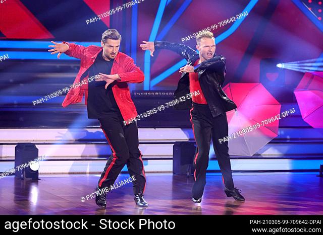 05 March 2021, North Rhine-Westphalia, Cologne: Nicolas Puschmann and Vadim Garbuzov perform during the first show of the 14th season of the dance competition...