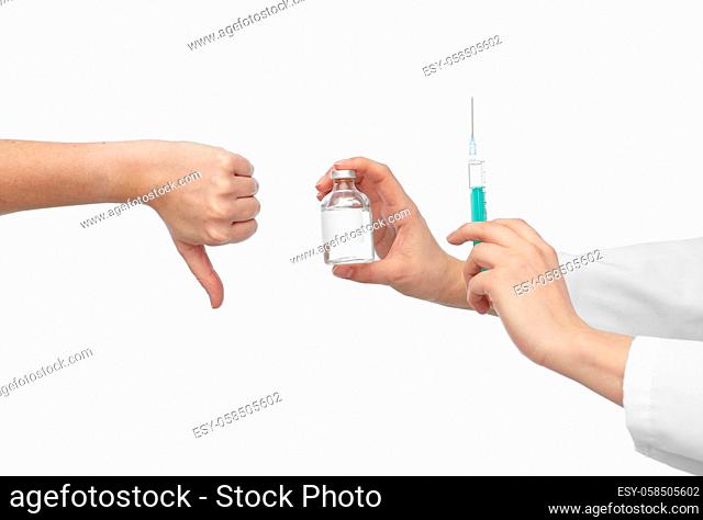 hand with medicine and showing thumbs down