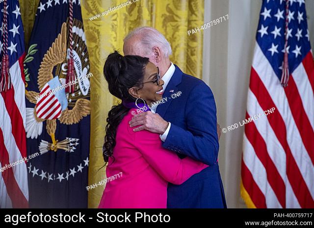 United States President Joe Biden, right, presents the Arts and Humanities Award to Gladys Knight, left, during a ceremony in the East Room of the White House...