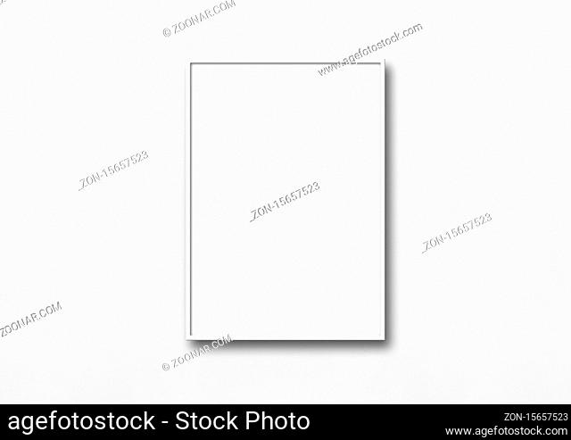 White picture frame hanging on a wall. Blank mockup template
