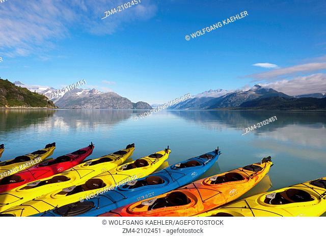 Sea kayaks next to cruise ship Safari Endeavour with Tarr Inlet and the Grand Pacific Glacier in background in Glacier Bay National Park, Southeast Alaska, USA