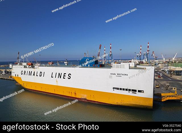White and yellow Grimaldi Lines ferry boat docked in Ashdod Port, Israel