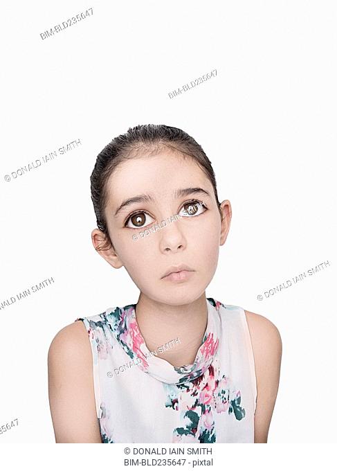 Portrait of sad Mixed Race girl with big eyes