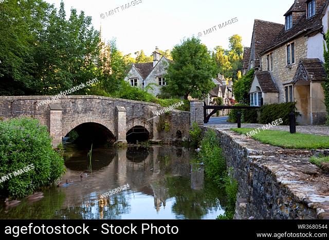 Bridge over River Bybrook in the village of Castle Combe, Wiltshire, UK