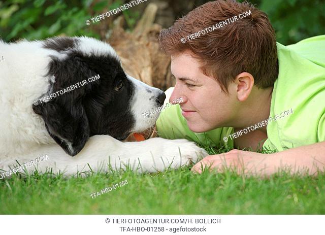 woman and Landseer Puppy