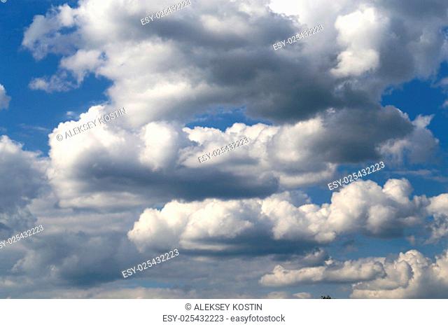 Beautiful white clouds photographed closeup against blue sky