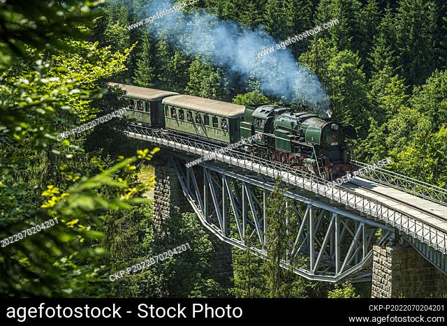 The steam steam locomotive 464.202 crosses a bridge on the line between Korenov and Sklarska Poruba, Poland, as part of the celebration of 120 years of the...
