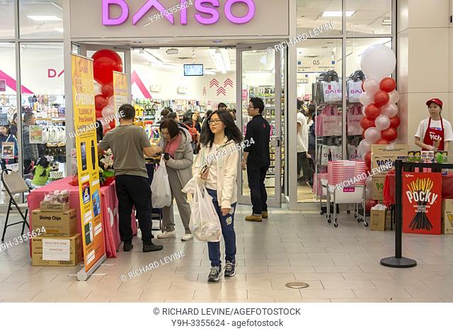 Shoppers queue up to enter the new Daiso store in the Skyview Mall in Flushing in New York on Saturday, March 9, 2019. The popular dollar store has 2800...