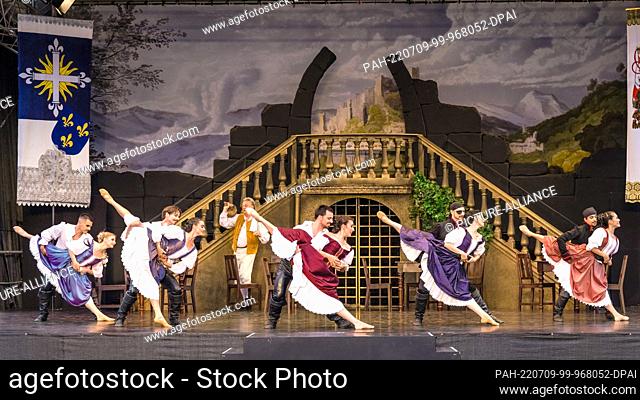 24 June 2022, Brandenburg, Cottbus: Dancers from the Cottbus State Theater dance during the dress rehearsal for the ballet piece ""The Three Musketeers"" on the...