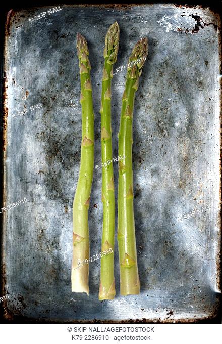 Sill life of three pieces of asparagus