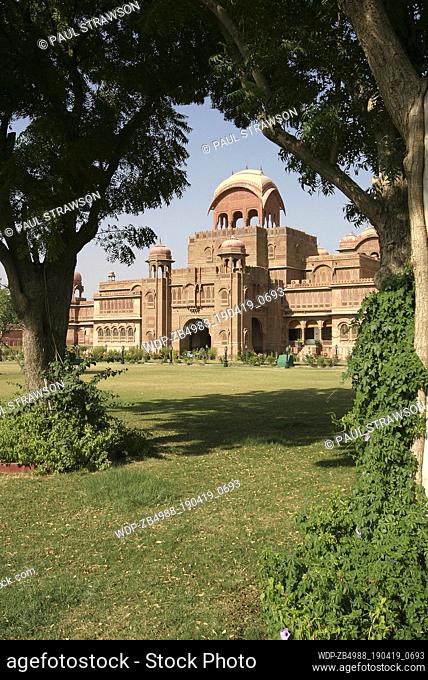 View of the Laxmi Niwas Palace framed by trees