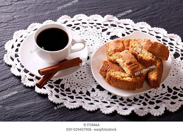 Italian breakfast: coffee and cookies with almonds on a table close-up. horizontal