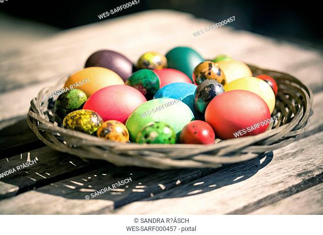 Germany, Colorful Easter eggs on wooden table