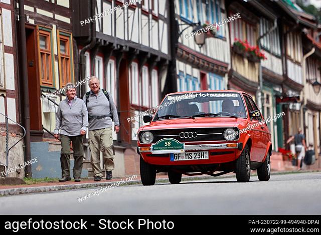 22 July 2023, Saxony-Anhalt, Stolberg: Participants in the traditional classic car excursion ""ADAC Sachsen-Anhalt Classic"" drive through the half-timbered...