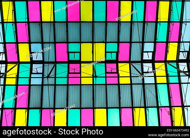 Colorful transparent roof made of glass and steel framing, abstract architecture background. Futuristic abstract texture