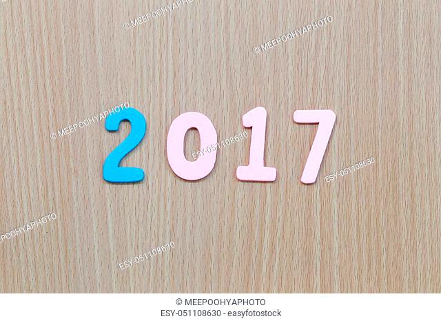 Number two thousand seven of wooden text on brown old wood floor in concept of the New Year 2017