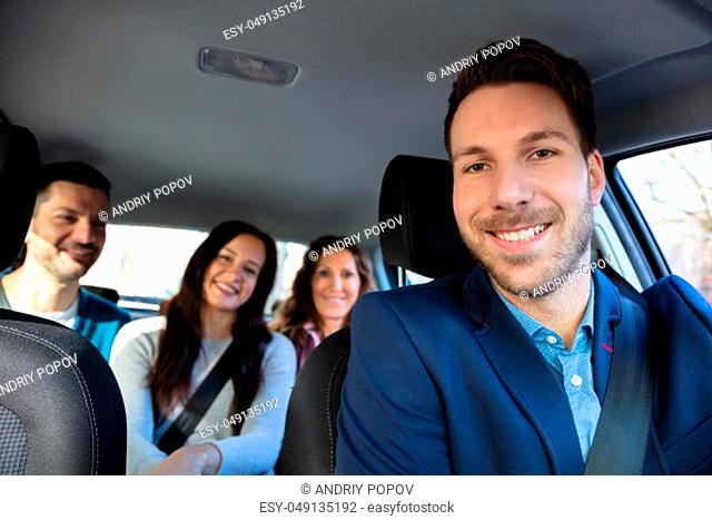 Group Of Happy Friends Having Fun In The Car