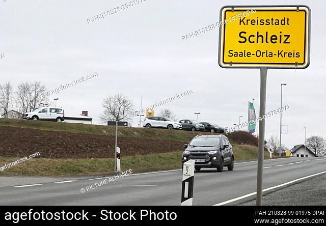 28 March 2021, Thuringia, Schleiz: The town entrance sign of the eastern Thuringian town with the seat of the district administration office