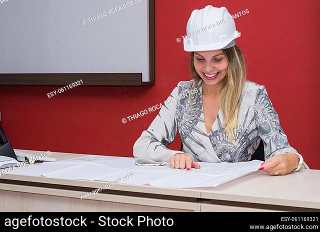 Woman working, projecting on table, architect, engineer