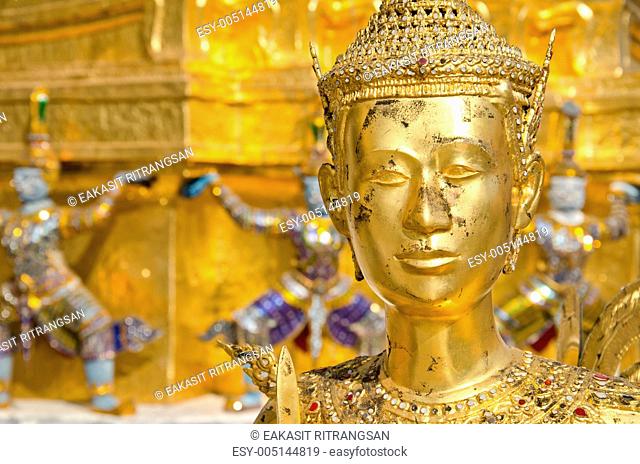 A Golden Kinnari statue at the Temple of the Emerald Buddha Wat Phra Kaew , Bangkok, Thailand