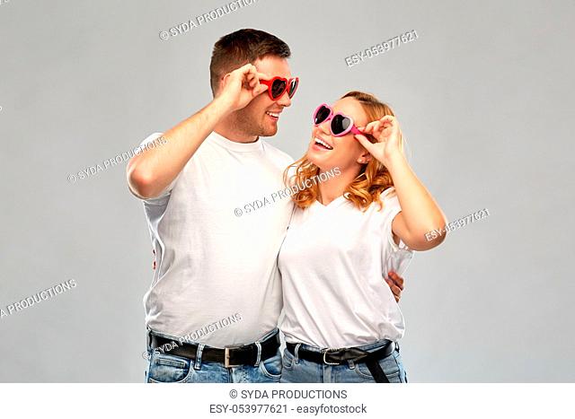 happy couple in white t-shirts and sunglasses