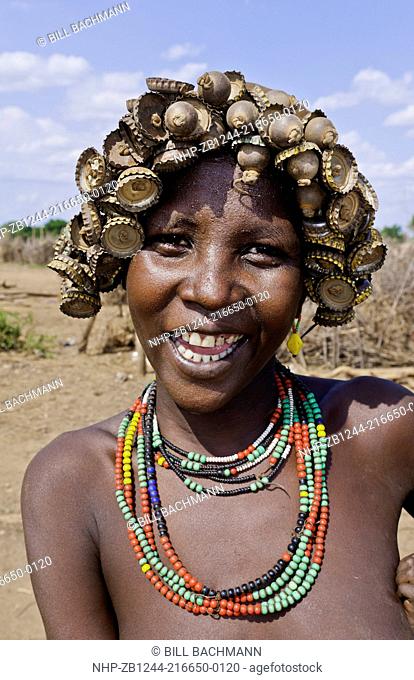Dassnech Tribe in Omorate Ethiopia Africa Lower Omo Valley wife portrait in village with headress 26