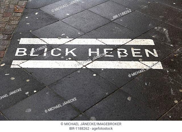 Blick heben, look up, written on pavement, footpath, Cologne, North Rhine-Westphalia, Germany, Europe
