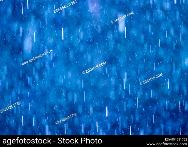 Drops of rain on blue abstract background