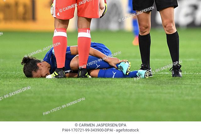 Ilaria Mauro from Italy lies injured on the ground during the women's European Soccer Championships group B match between Germany and Italy at the Koning Willem...