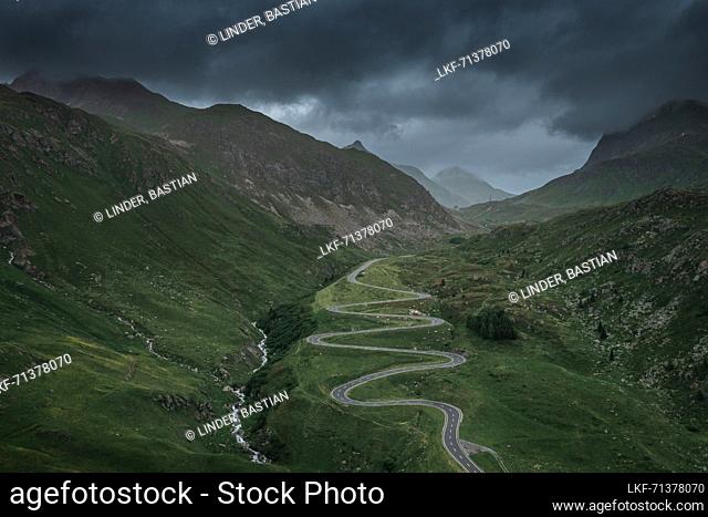 Julier Pass in summer with a dramatic cloudy sky in the Swiss Alps in GraubÃ¼nden from above