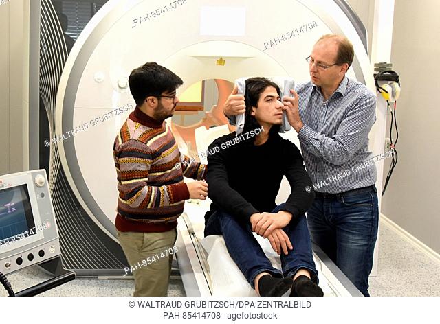 Scientists and study conductor Dr. Alfred Anwander (r) and Portuguese Tomas Goucha of the Max-Planck-Institute for Cognitive and Neuroscience prepare the...