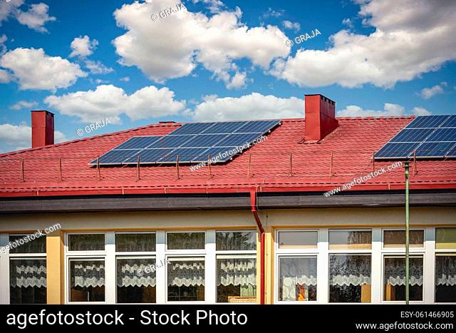Solar cell panels are using renewable sun energy for making electricity, placed on house roof. Modern energy saving technology